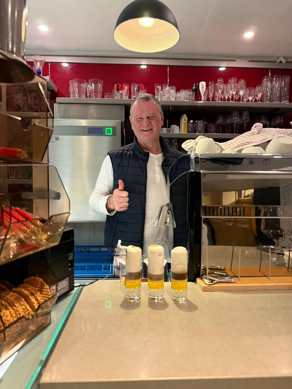 Daniele behind the counter