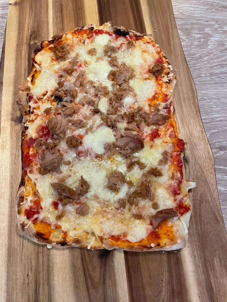 Warm Italian focaccia with tomato, cheese and tuna